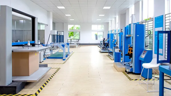 Chair testing laboratory at Anji Shengxin with rows of durability test rigs